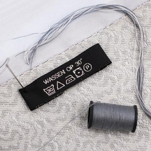 15mm label met eigen logo en onderhoudsvoorschriften